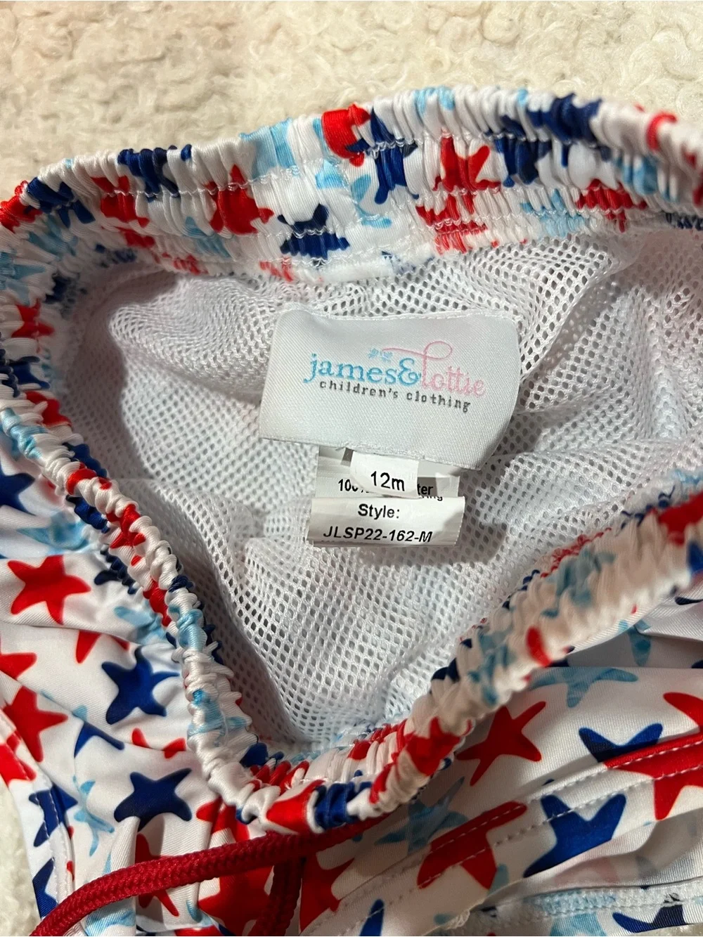James & Lottie Baby White Star-Print Swim Shorts with Red & Blue Accent